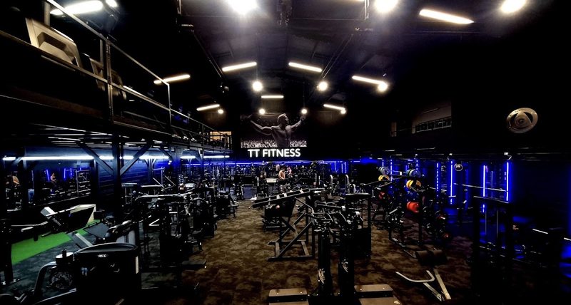 An elevated view of the machines and free weights on TT Fitness’s training floor
